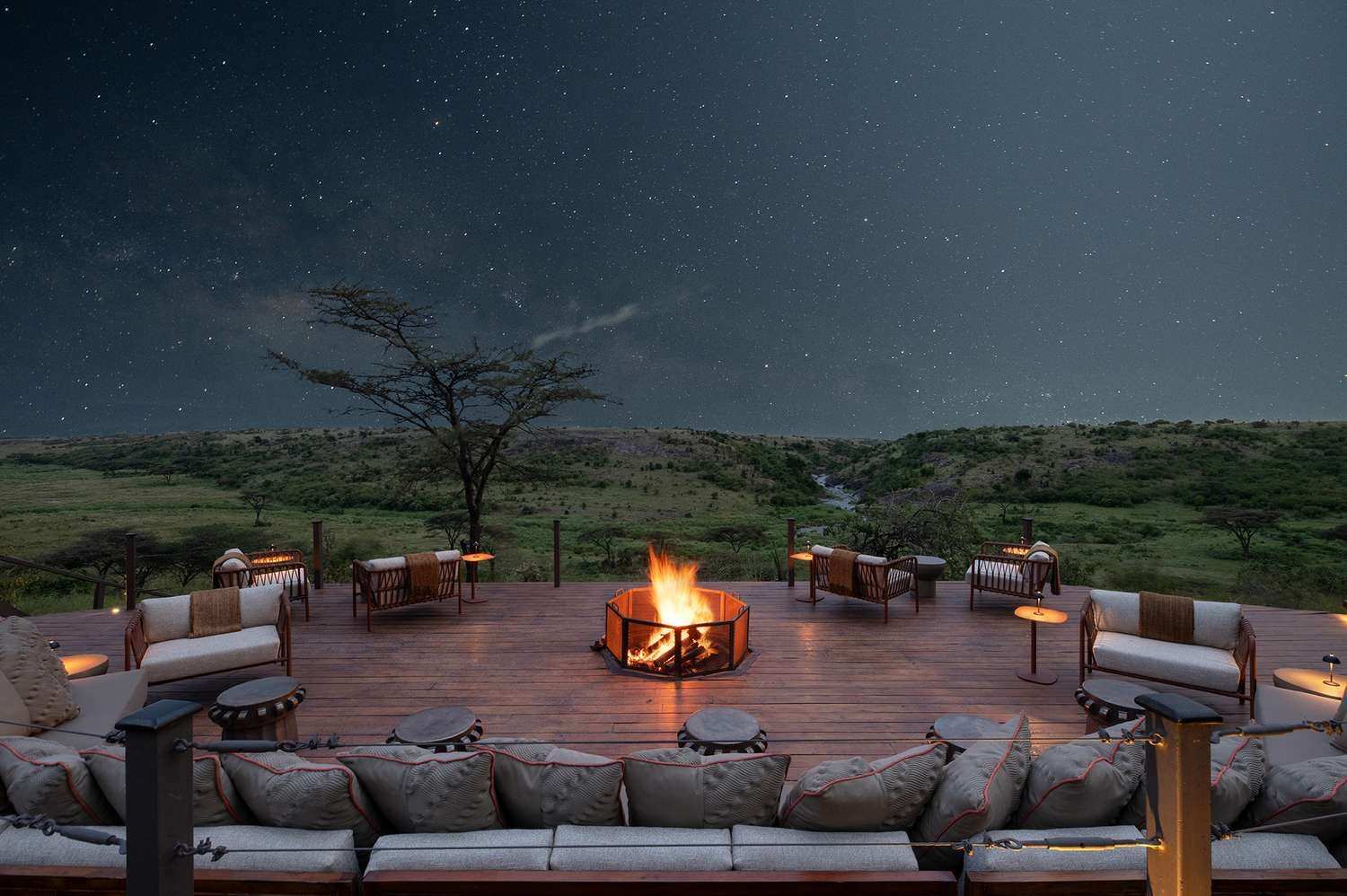 Safari camp fire pit under a starry sky in the Maasai Mara
