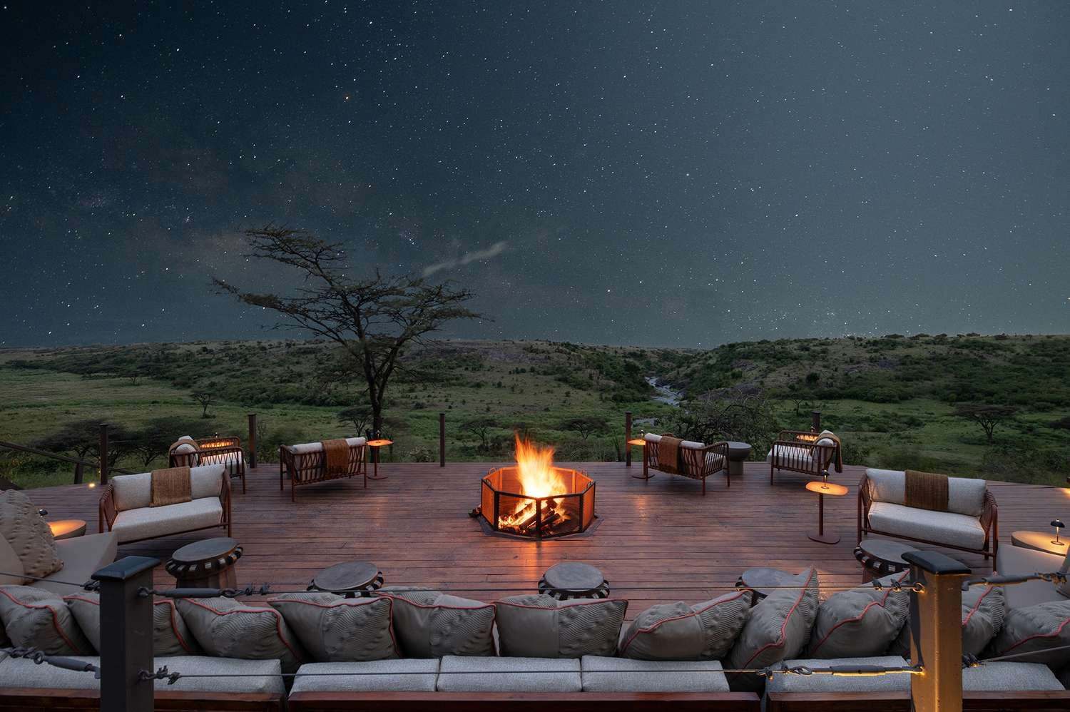 Safari camp fire pit under a starry sky in the Maasai Mara