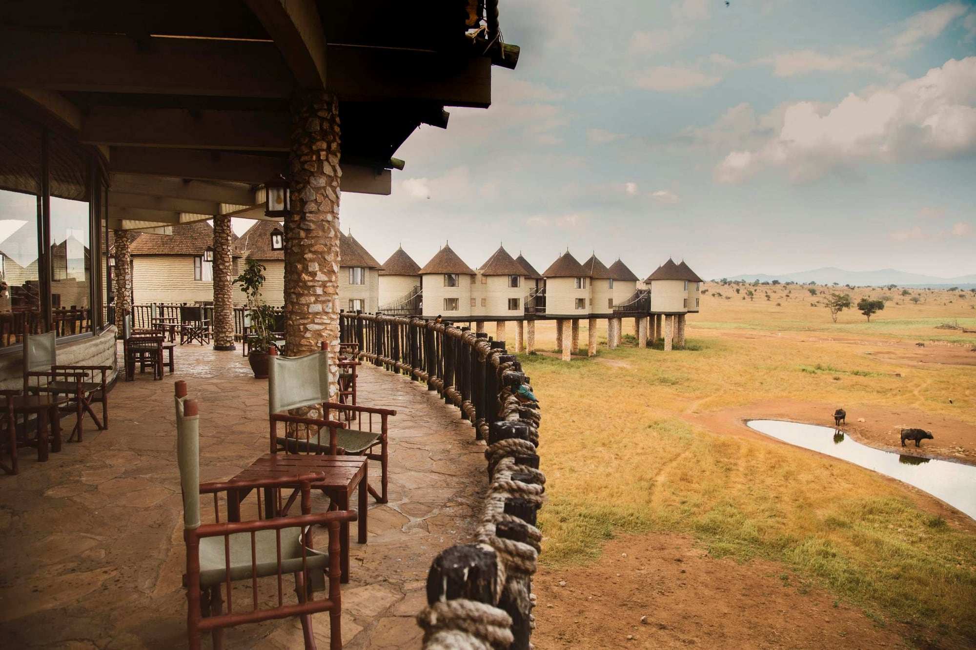 The deck at Salt Lick Safari Lodge, with stilted rooms overlooking a waterhole in the Taita Hills