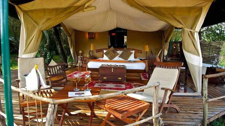 Dining table set inside a safari tented camp