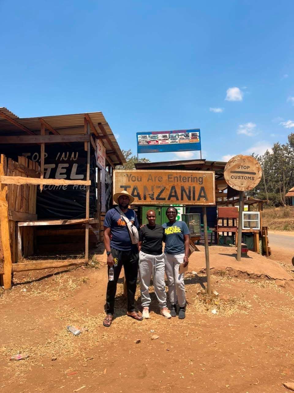 Travellers at the Tanzania border sign on an overland trip